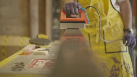Machine spreading wax with rack focus Video stock 345804567