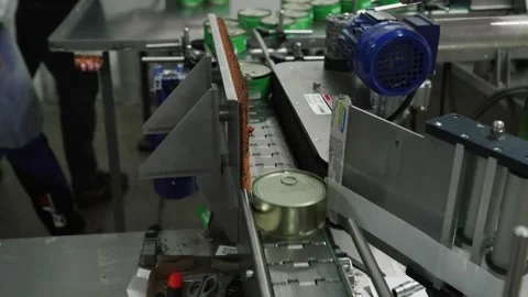 A machine that sticks labels on containers. Fresh Pork Manufacturing Plant. Stock Footage 251853178