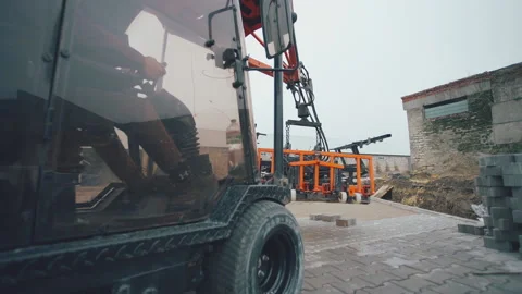 The machine takes part of the gray pavement for further installation Vídeos de archivo 195691177