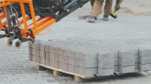 The machine takes part of the gray pavement for further installation Vídeos de archivo 195691897