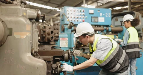 Machine technicians in a factory are checking electrical equipment and machines  Stock Footage 230631736