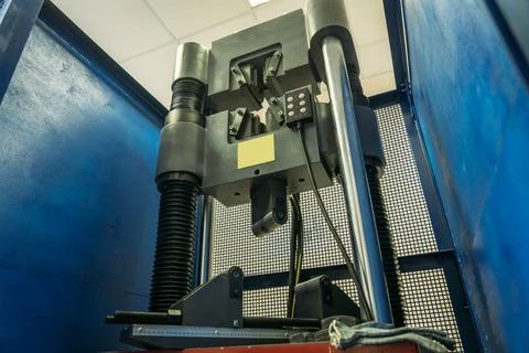 Machine for testing metals for strength and deformation in laboratory at Stock Photos