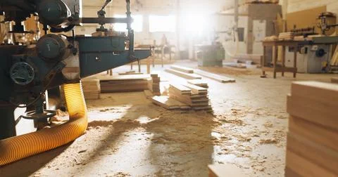 Machine, timber and carpentry in empty workshop if furniture manufacturing Stock Photos