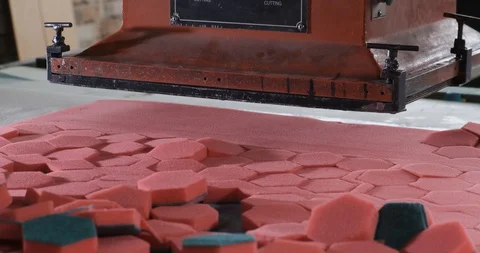 Machine tool cuts out hexagonal workpieces from sheets of synthetic material Stock Footage 128786849