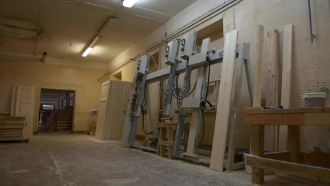 Machine tool near stack of inner doors in plant workshop Stock Footage 140672609