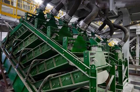 Machine tool operates with mineral ore at mining plant Stock Photos