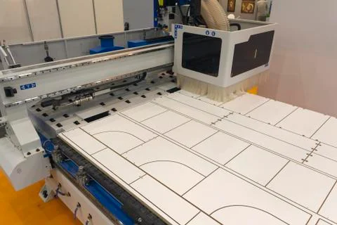 Machine tools format cutting are cut chipboard furniture in the shop Stock Photos