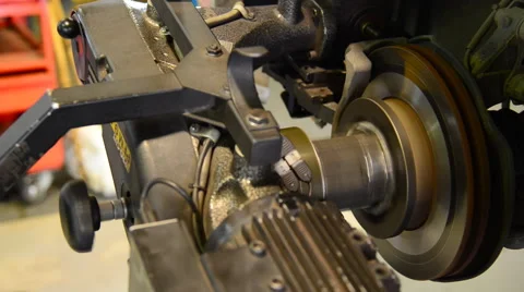 Machine turning car brake, Auto machine grinding the brakes car. Stock Footage 47726260