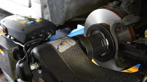 Machine turning car brake, Auto machine grinding the brakes car. Stock Footage 47726893