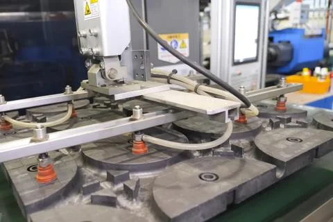 Machine with vacuum suction cups moves the PP product Stock Photos