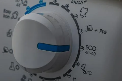 Machine wash, eco-friendly program, saving energy and water, thermostat kno.. Stock Photos