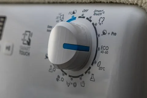 Machine wash, eco-friendly program, saving energy and water, thermostat kno.. Stock Photos