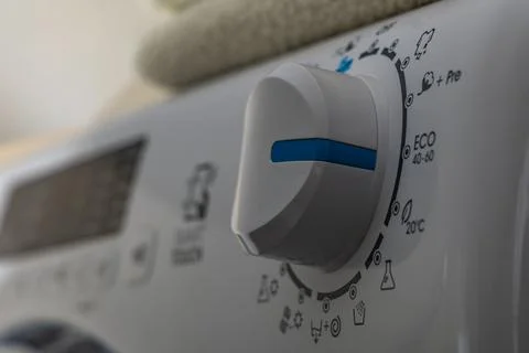 Machine wash, eco-friendly program, saving energy and water, thermostat kno.. Stock Photos