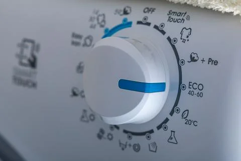 Machine wash, eco-friendly program, saving energy and water, thermostat kno.. Stock Photos