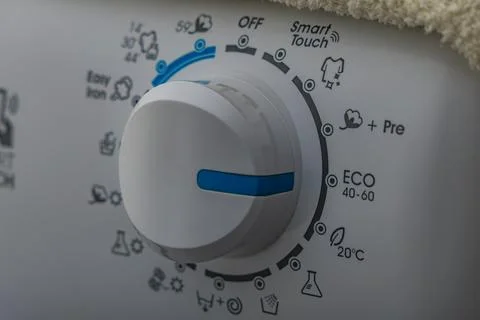 Machine wash, eco-friendly program, saving energy and water, thermostat kno.. Stock Photos