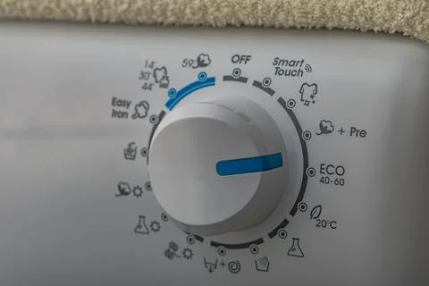 Machine wash, eco-friendly program, saving energy and water, thermostat kno.. Stock Photos