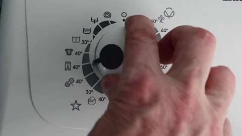 Machine wash wool is selected on program selection dial of washing machine. Stock Footage 235790900