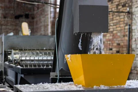 The machine washes and cuts the plastic film for recycling Stock Photos