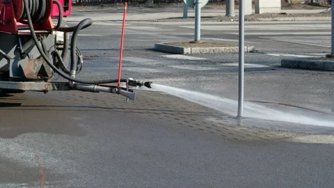 The machine is washing the street in spring after winter. Stock Footage 138434850