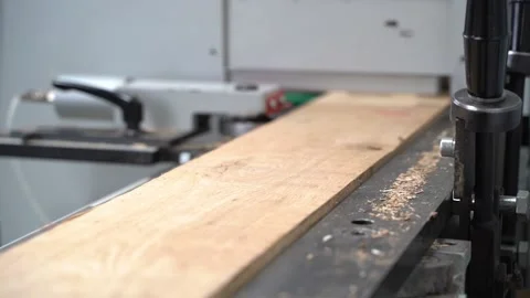 A machine in which boards pass on a tape and are sawn. Stock Footage 144470078