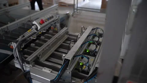 The machine into which the wooden blocks are passed and selected, sorted. Stock Footage 144470069