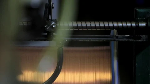 The machine winds the copper cable onto the reel Video stock 76951030