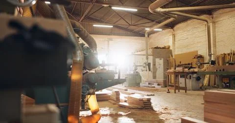 Machine, wood and carpentry in empty workshop for furniture manufacturing Stock Photos