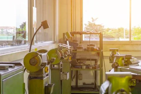 Machine work shop with grinder machine and bench Vise Stock Photos