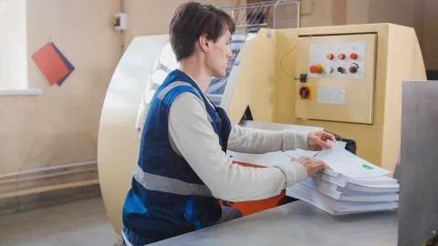 Machine working in printing house, polygraph industry Stock Photos