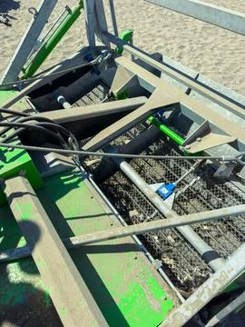 Machine working on sand in a construction site during daylight hours Stock Photos