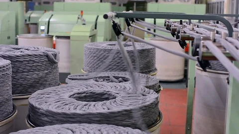 Machinery and equipment in the workshop. Interior of industrial textile factory. Stock Footage 99306435
