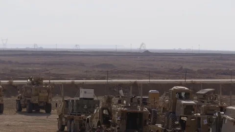 Machinery and troops during fortification of Base al Qaim, Iraq Stock Footage 84676499
