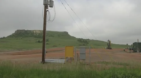 Machinery and trucks pumping fracking fluid in Bakken Stock Footage 47487251