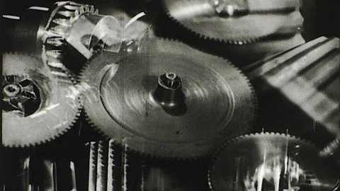 Machinery Cogwheels Cogs Gears Mechanical Wheels Turning Vintage Old Film Movie Stock Footage 118564949