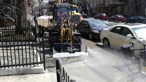 Machinery equipment cleans sidewalk Stock Footage
