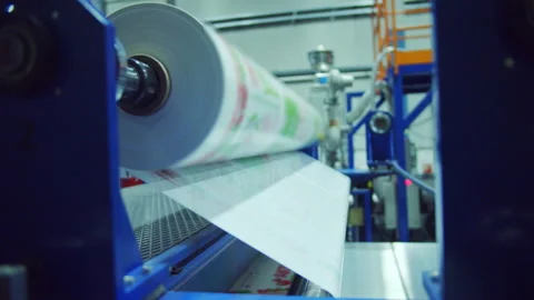 Machinery equipment unrolls monolithic polycarbonate sheet Stock Footage 228779953