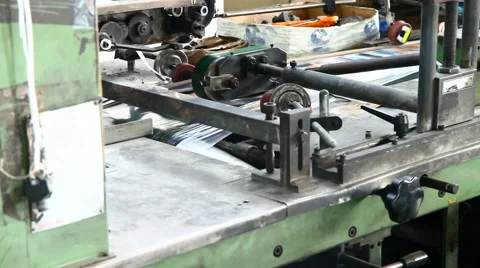 Machinery for sorting and cellophane magazines Stock Footage 67376173