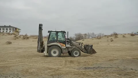 Machinery at work on a sandy beach 스톡 동영상 299641515