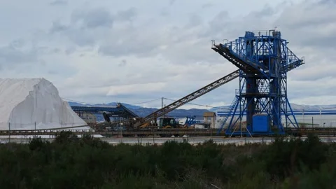 Machinery working in the salt flats of Santa Pola, Spain Stock Footage 332632422