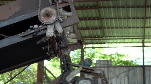 Machines are making separate plastic bottles for recycling in the factory. Stock Footage 111572900