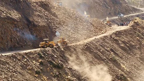 Machines constructing a new road in the Ecuadorian Andes,operating at a high Stock Footage 128434514