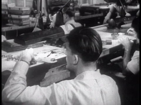 Machines make watch making machines and pieces, watches are designed, and a Video stock 74975131