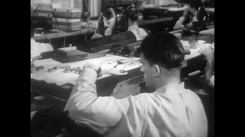 Machines make watch making machines and pieces, watches are designed, and a Video stock 88554171