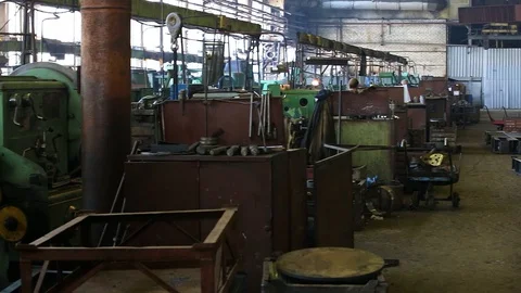 Machines at the old factory in the workshop with workers. Panorama Stock Footage 129305912