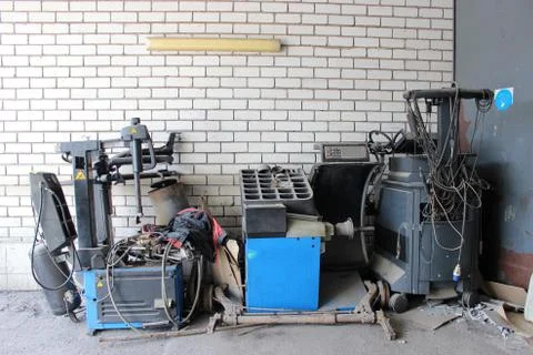 Machines stand at a brick wall Stock Photos