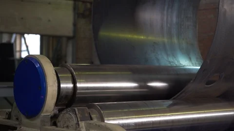 Machines twist metal into pipe, process before welding, industry, metal rolling Stock Footage 120062042