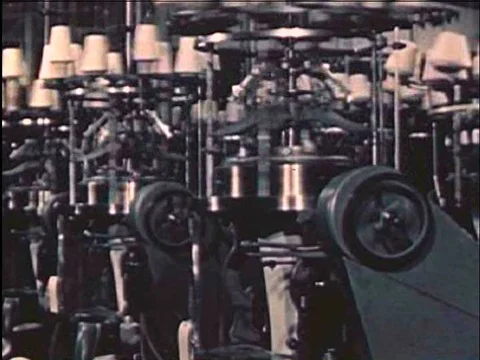 Machines wind and knit in a textile factory in the 1940s. Video stock 75291043