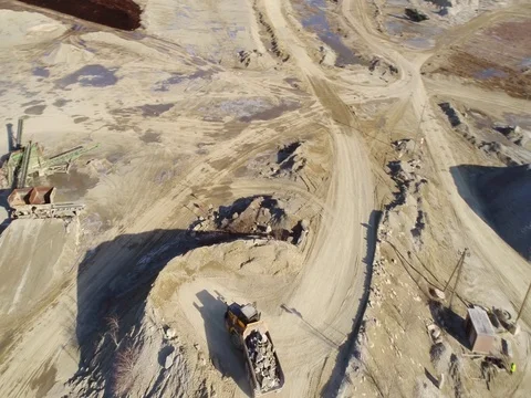 Machines work on a huge quarry for the extraction of stone Stock Footage 73194325