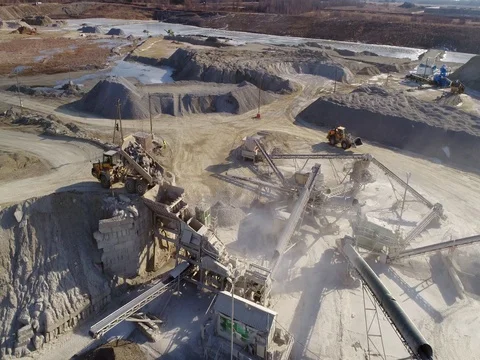 Machines work on a huge quarry for the extraction of stone Stock Footage 73196279