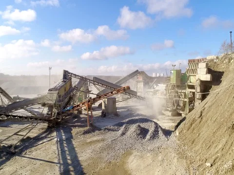 Machines work on a huge quarry for the extraction of stone Stock Footage 73197215
